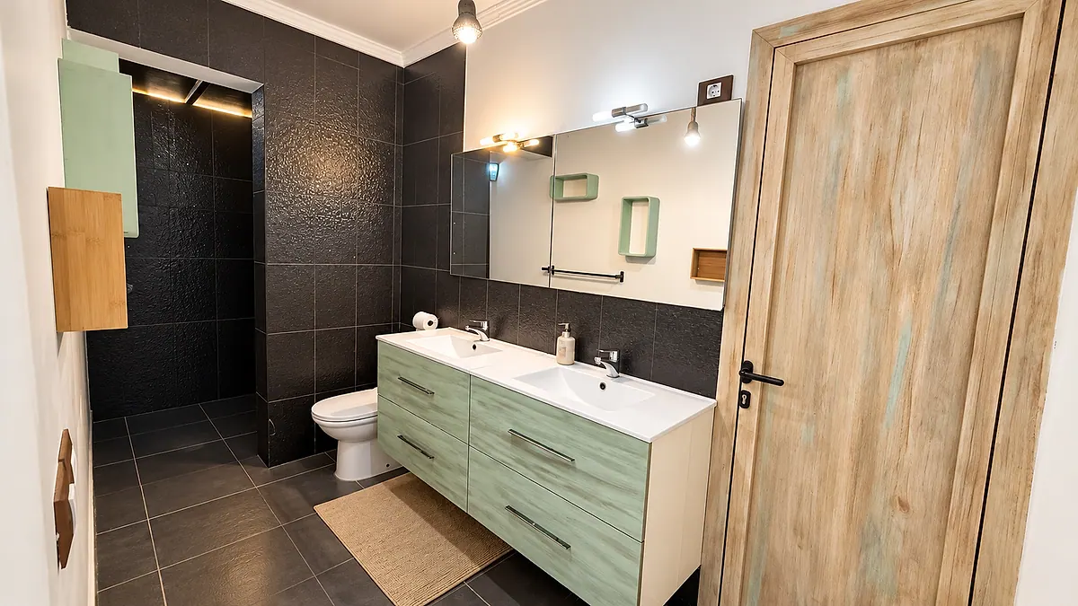 Bathroom with double sink and shower